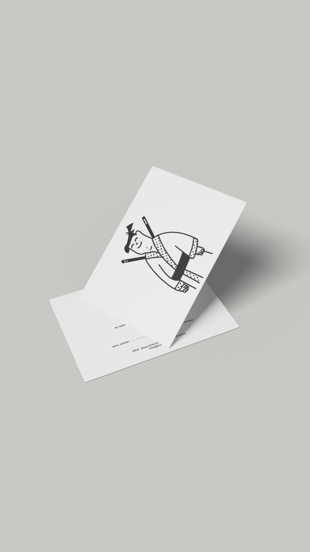 Papierowy voucher BĀR z ilustracją Kazu, ustawiony na białej kopercie